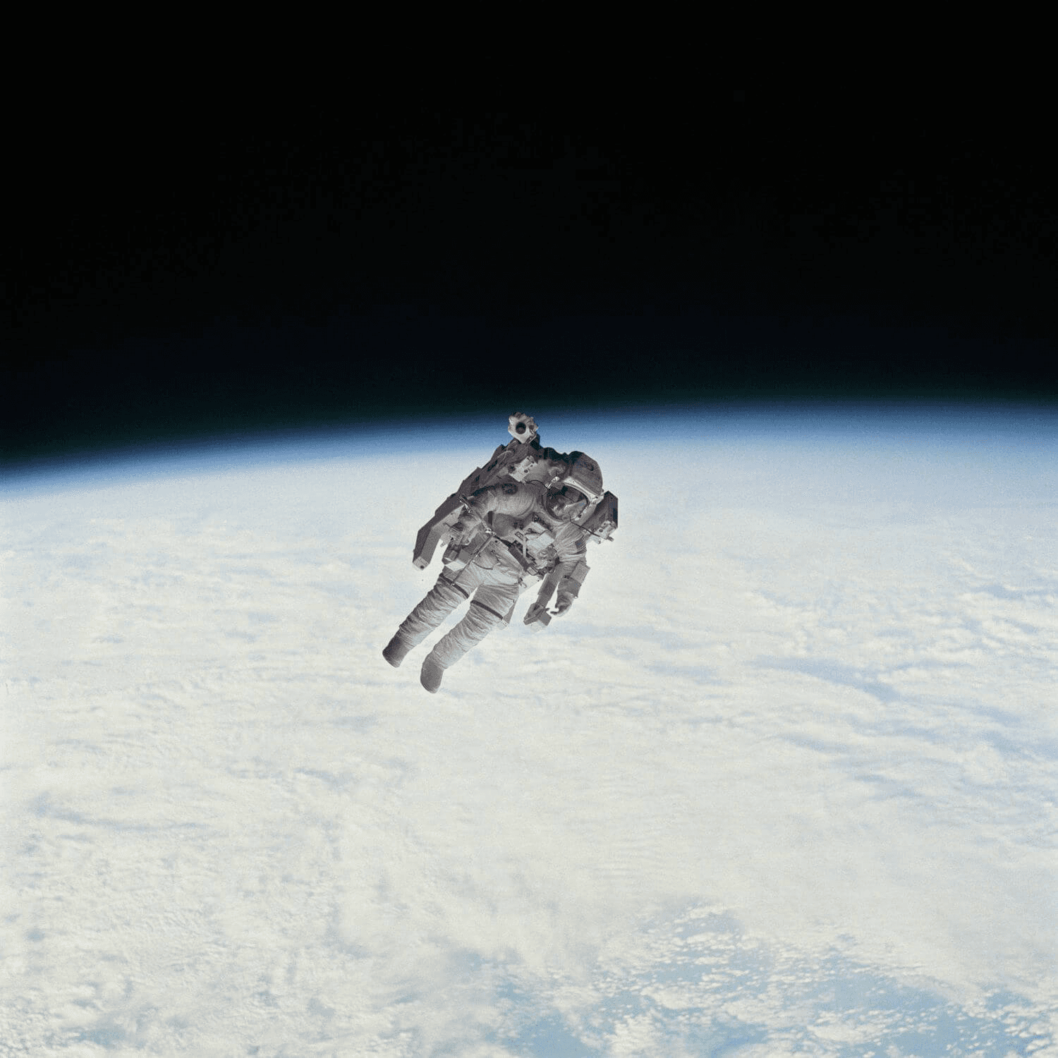 Astronaut floating in space above Earth